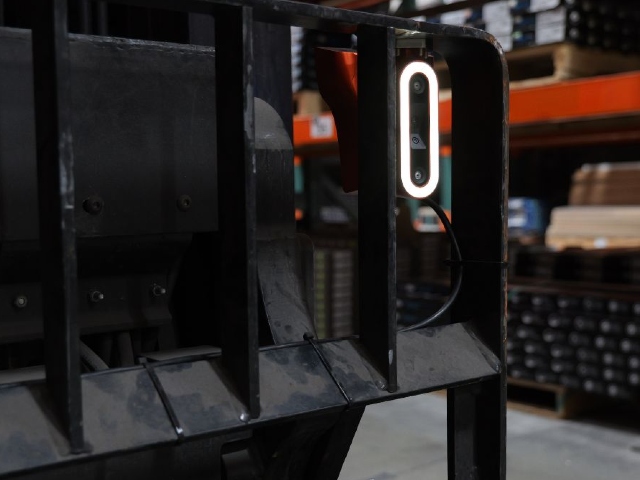 Corvus Trident AI copilot device mounted on a forklift backrest for real-time pallet tracking in warehouse operations.
